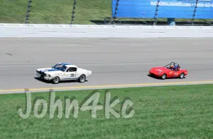 Elva chases Shelby mustang at Kansas Speedway